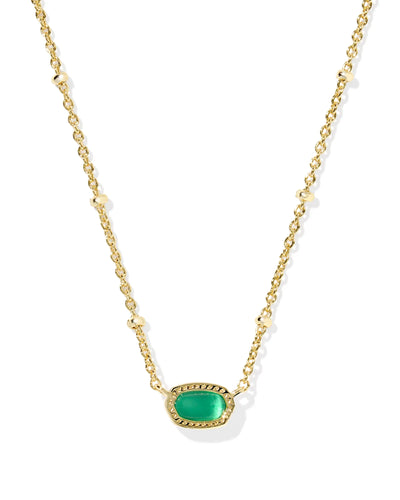 Gold necklace with a green pendant on a white background
