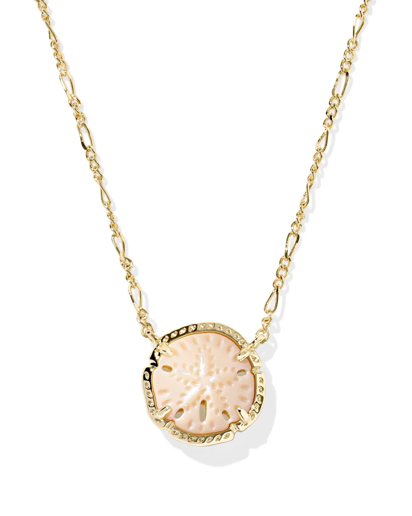 Gold figaro chain necklace with sand dollar pendant on white background, closeup front.