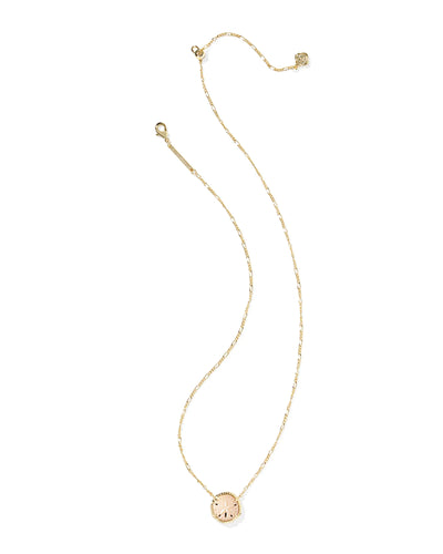 Gold figaro chain necklace with sand dollar pendant on white background, full front.