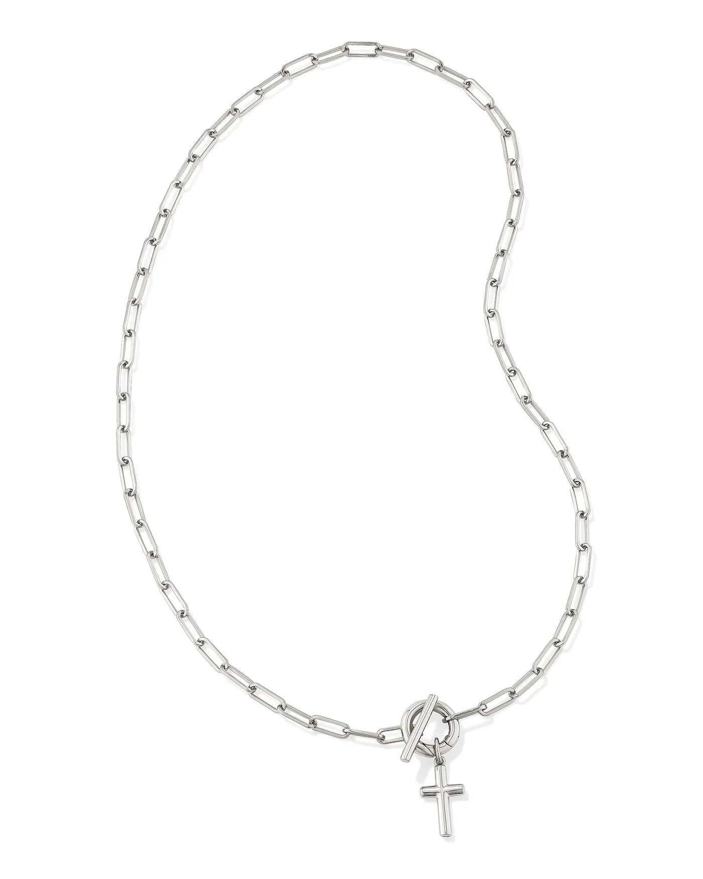 Silver chain link necklace with small cross pendant on white background.