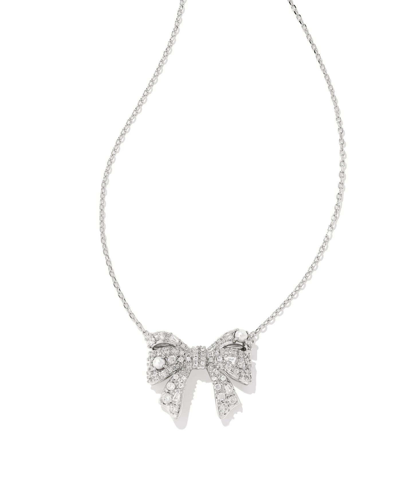 Silver bow-shaped necklace on a white background.