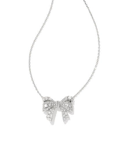 Silver bow-shaped necklace on a white background.