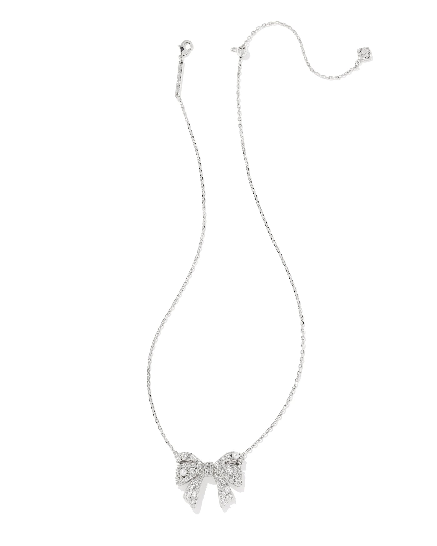 Silver bow-shaped necklace on a white background.