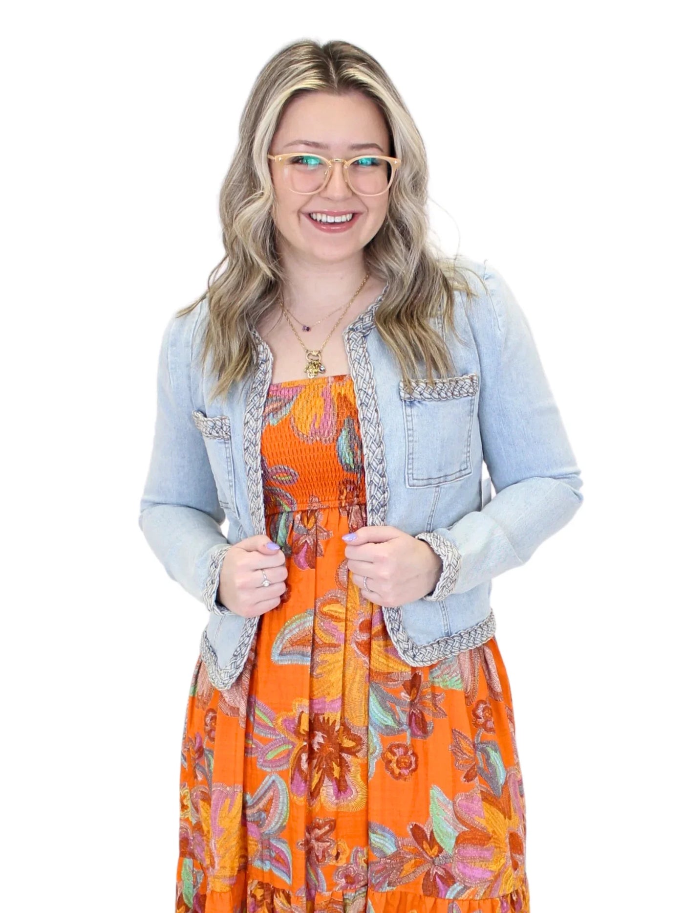 Light wash braided trim jean jacket on model, closeup front.