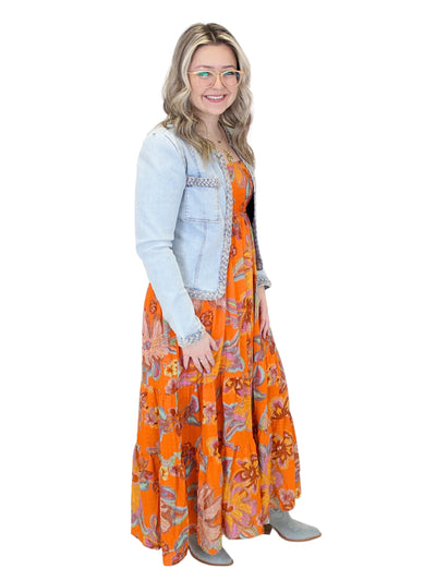 Light wash braided trim jean jacket on model, full side.