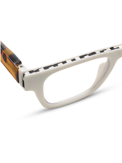 Close-up of a white eyeglass frame with tortoiseshell accents on a white background.