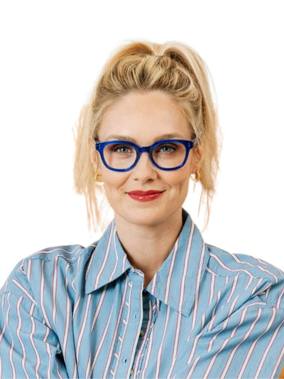 Woman wearing blue glasses and a striped shirt on a white background.