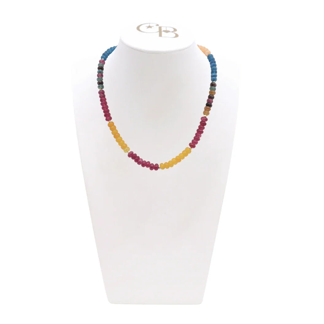 Colorful beaded necklace on a white mannequin with a visible brand logo.