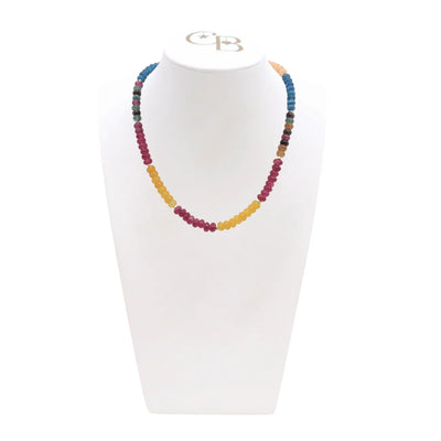 Colorful beaded necklace on a white mannequin with a visible brand logo.