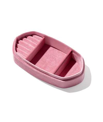 Pink jewelry box with compartments on a white background