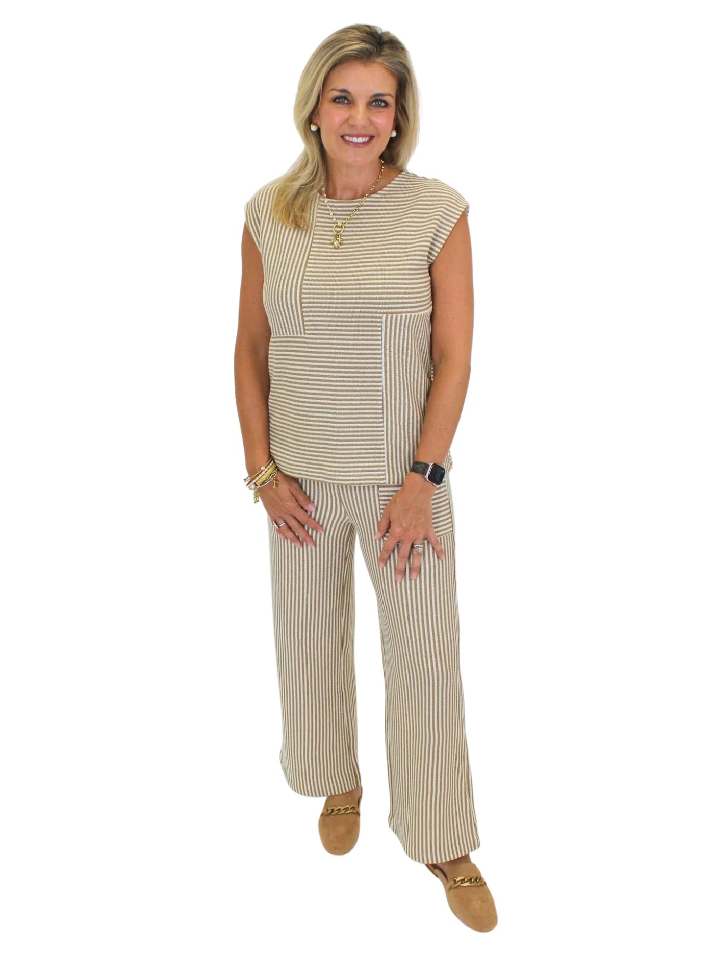 Model wearing brown and white striped knit set on white background, front.