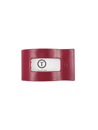 Maroon rectangle hair clip on white background, front.