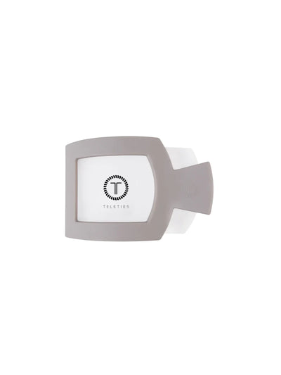 Light grey medium square hair clip on white background, front.