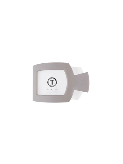 Light grey small square hair clip on white background, front.