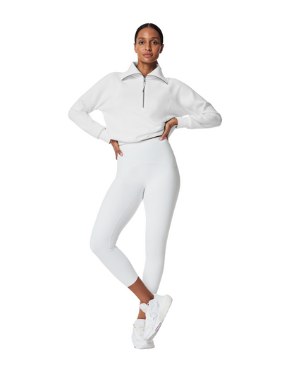 Spanx Booty Boost Leggings - White in size medium on model, front view.