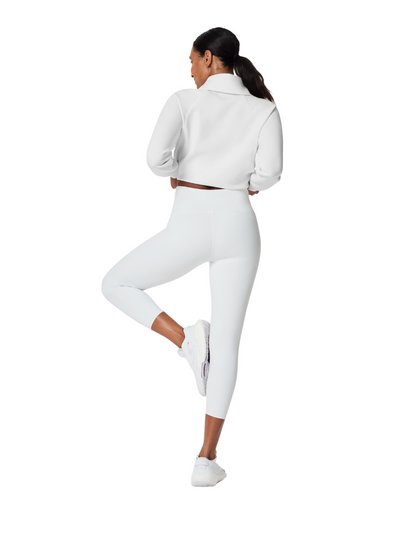 Spanx Booty Boost Leggings - White in size medium on model, rear view.
