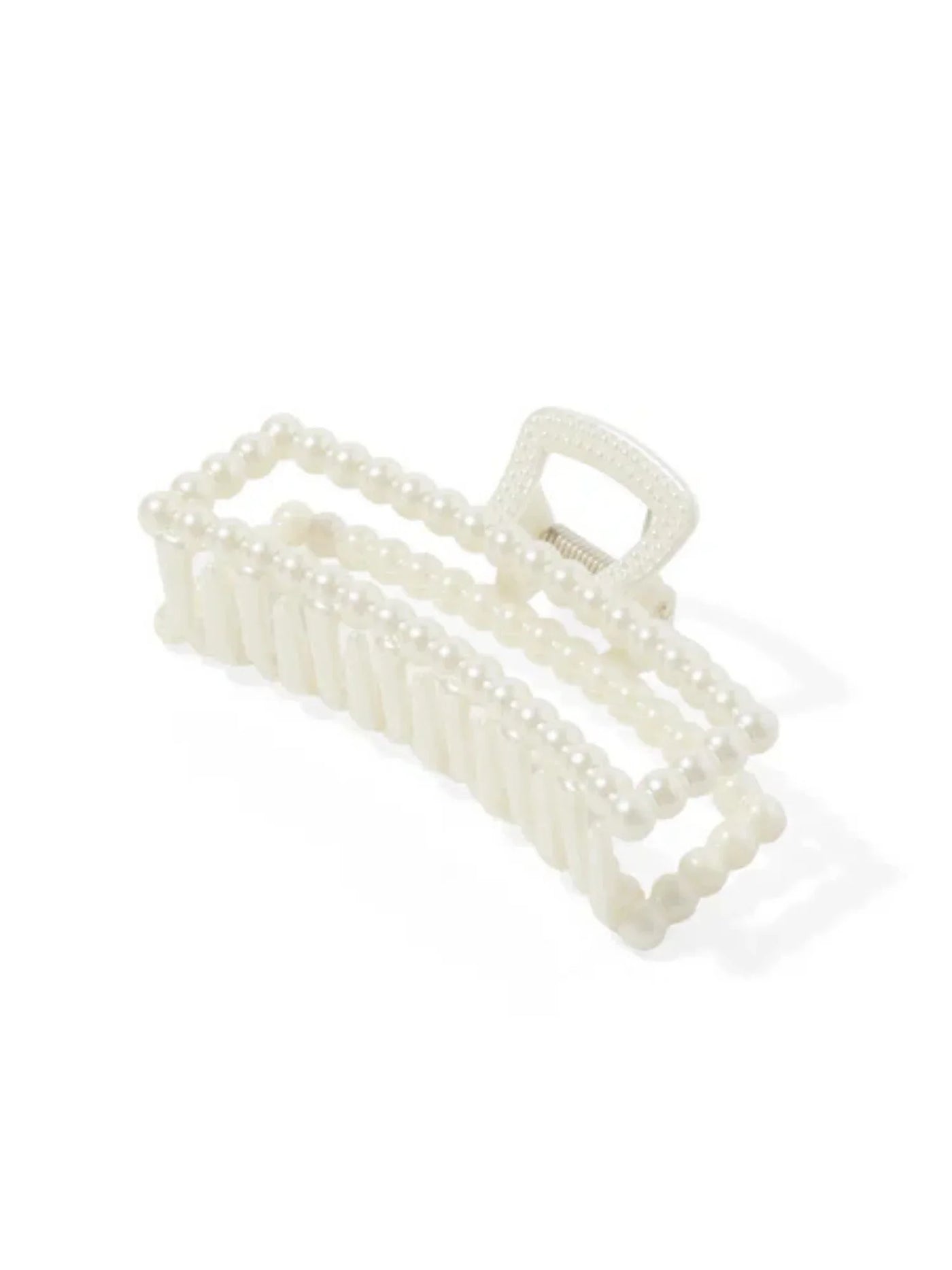 White pearl hair clip on a white background