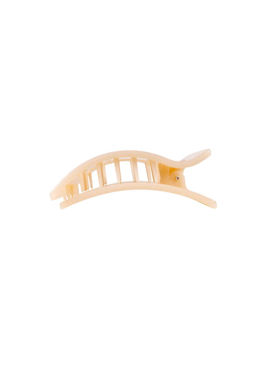 Beige small flat rectangle hair clip on white background, side.