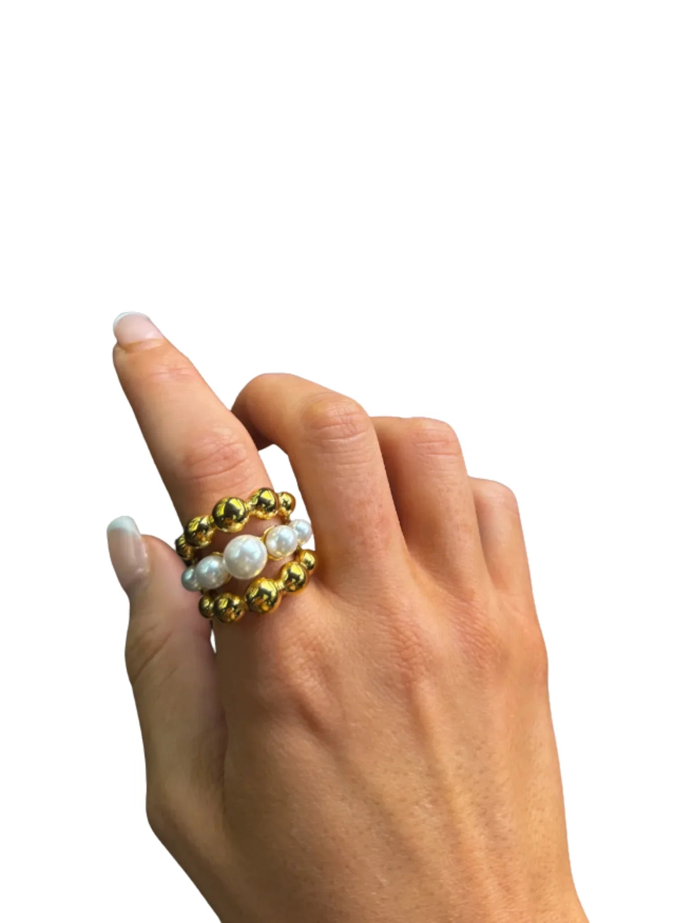 Hand wearing a gold and pearl bubble ring on white background.