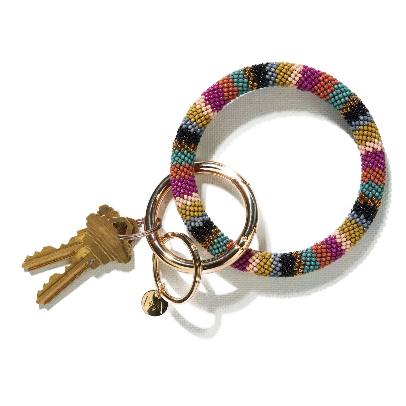 Chloe key ring in muted rainbow, front view.