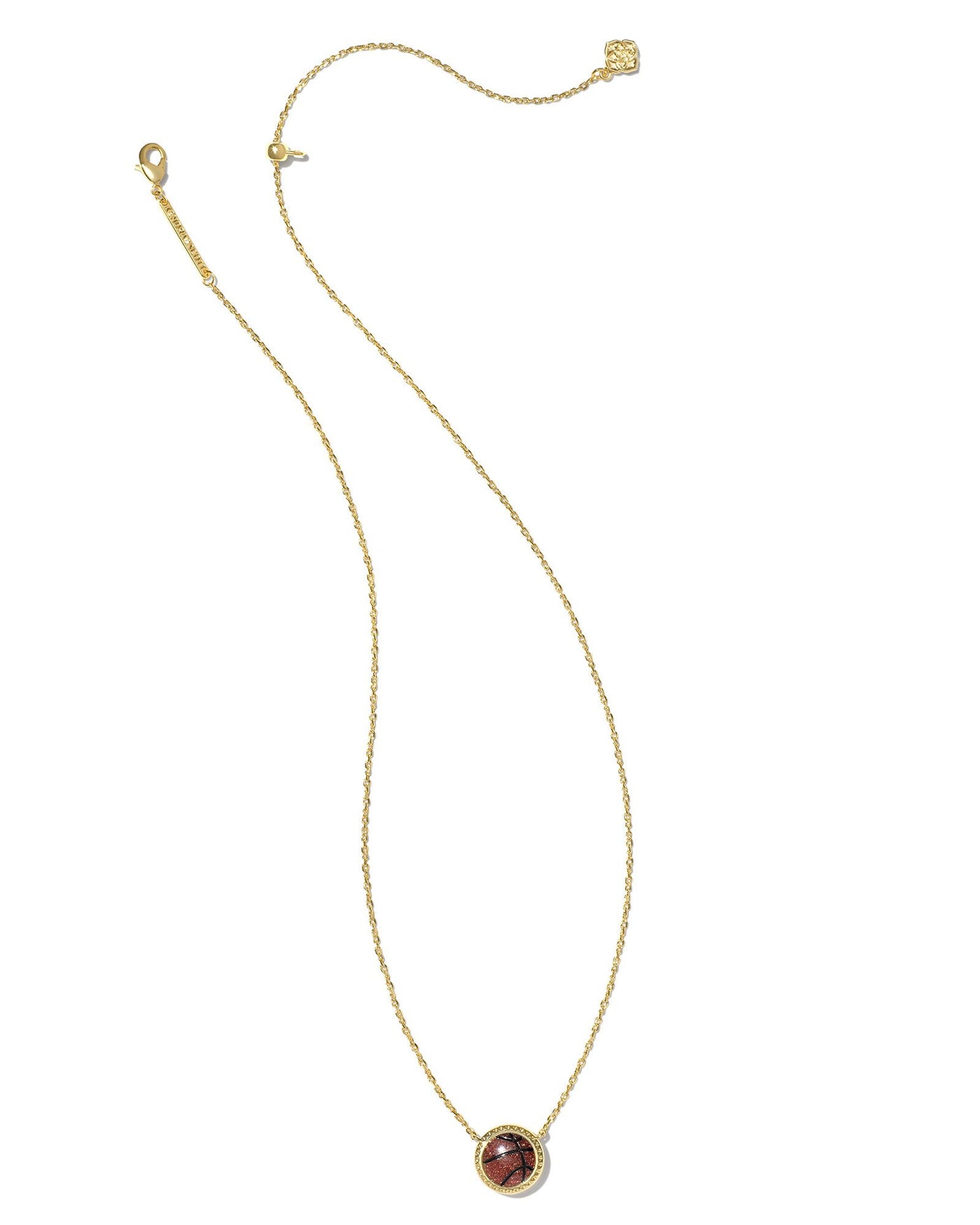 Kendra Scott Basketball Pendant Necklace in Gold on white background full view.