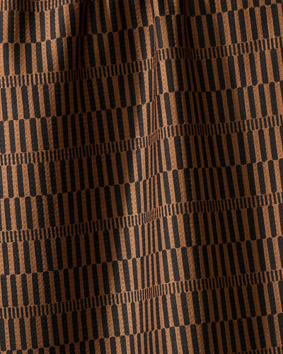 Closeup of brown and black striped tea towel.