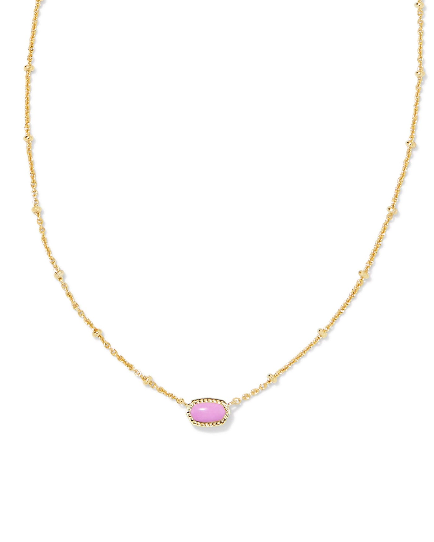 Kendra Scott Mini Elisa Satellite Necklace in Gold Pink Magnesite on white background close up.