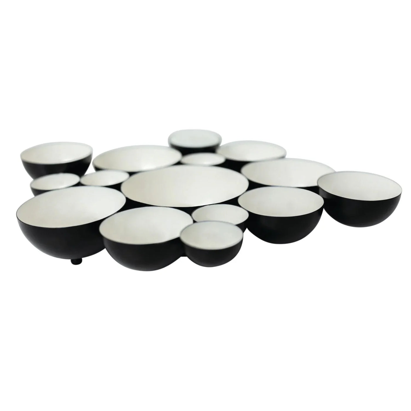 Set of black and white ceramic bowls arranged in a circular pattern on a white background