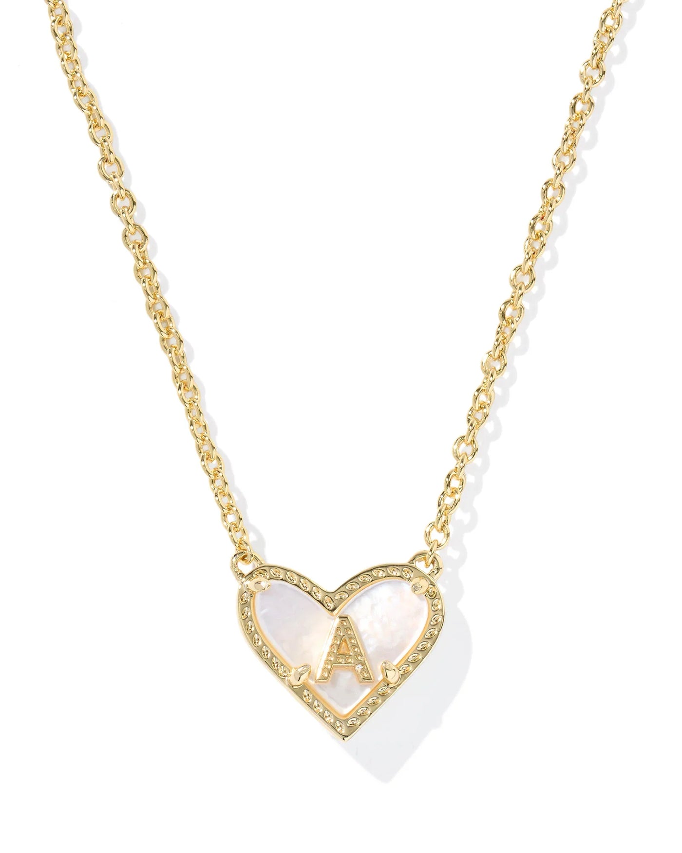 Gold necklace with a heart-shaped pendant and letter "A" on a white background, closeup.