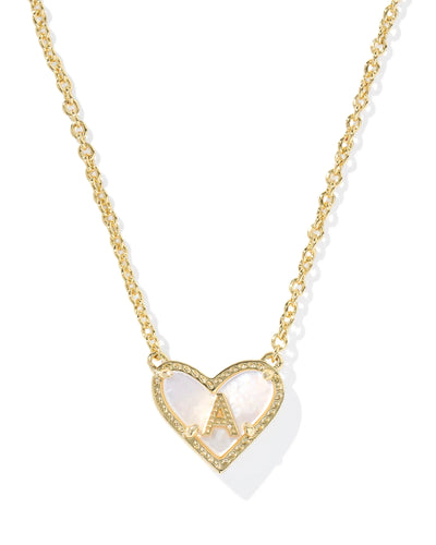 Gold necklace with a heart-shaped pendant and letter "A" on a white background, closeup.