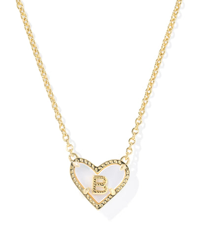 Heart-shaped necklace with a letter 'B' pendant on a white background.