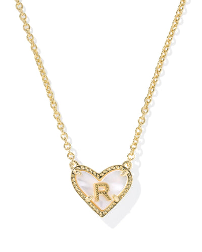 Gold necklace with a heart-shaped pendant featuring the letter 'R' on a white background.