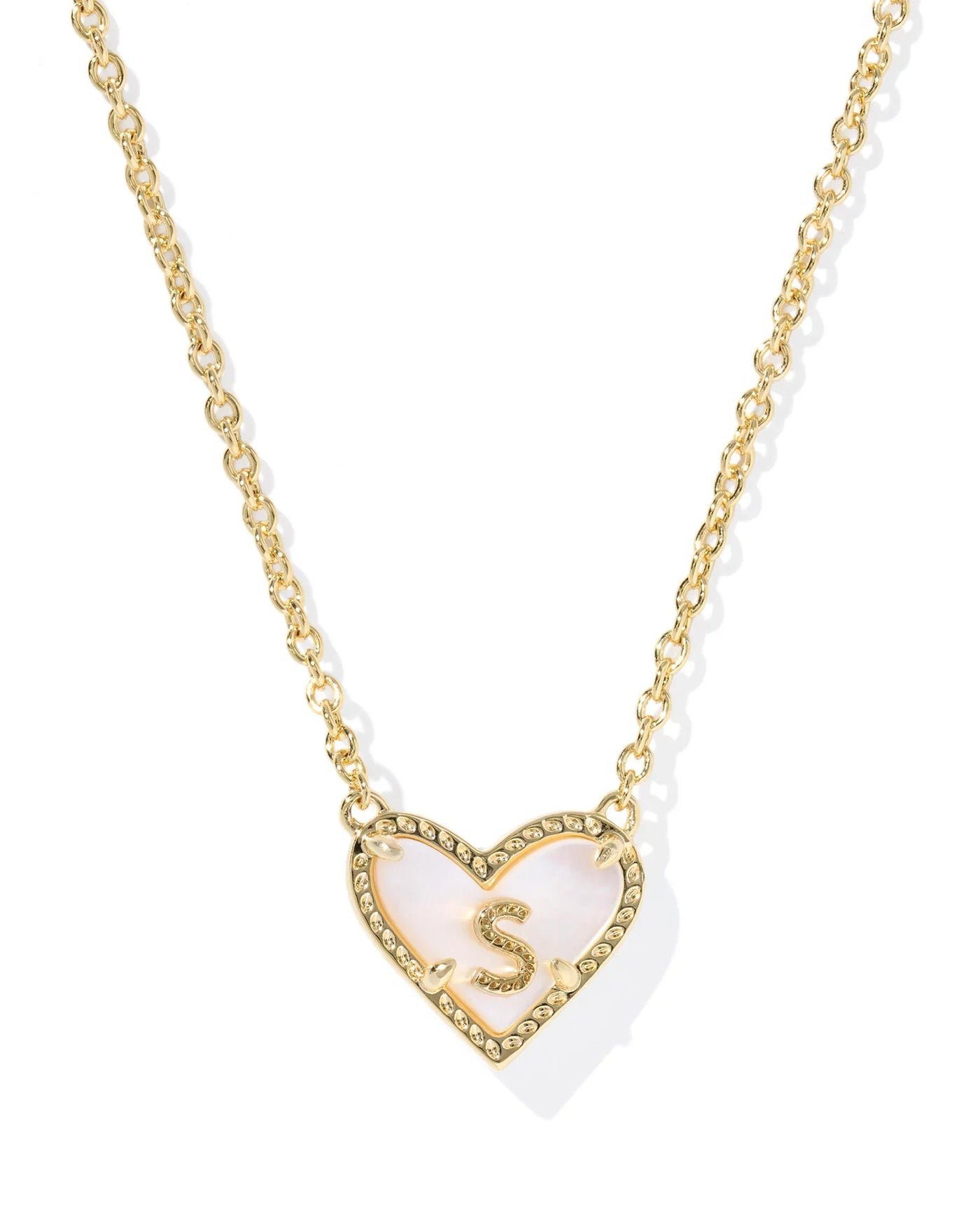 Necklace with a heart-shaped pendant featuring the letter 'S' on a white background.