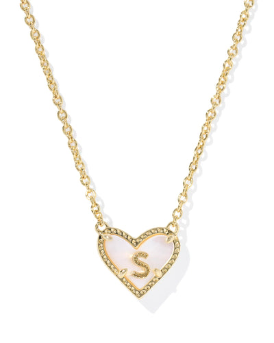 Necklace with a heart-shaped pendant featuring the letter 'S' on a white background.