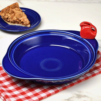 Blue Nora Fleming pie plate with red pitcher mini