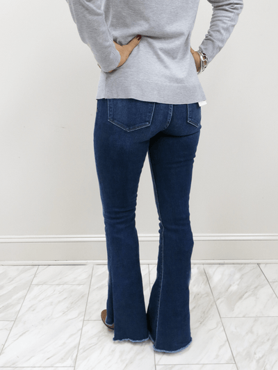 Flying Money Rolling in the blues flare jeans back view with slit and raw hem.