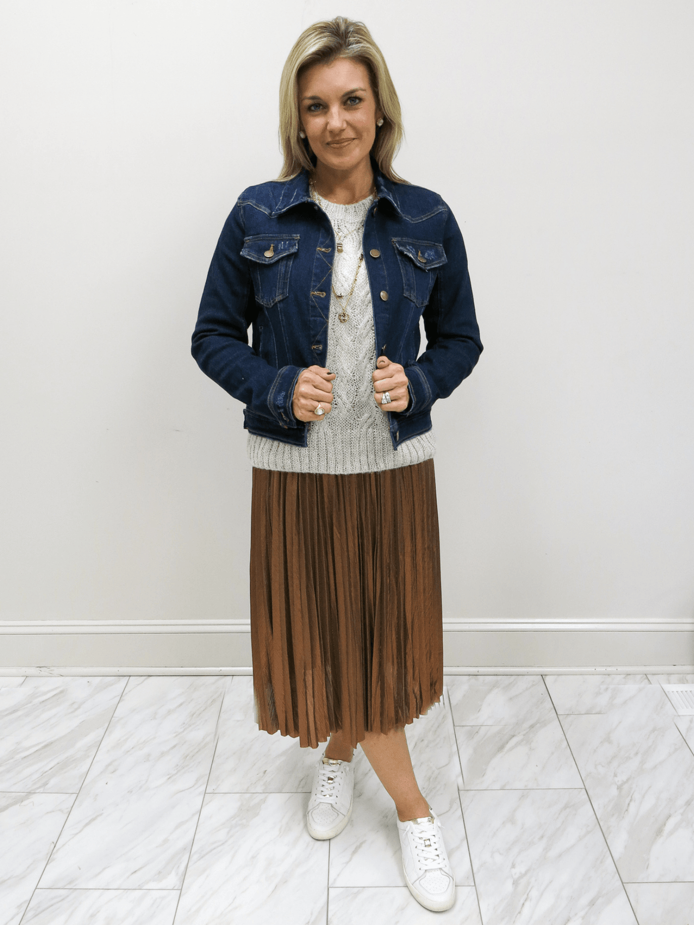 Molly Bracken Metallic pleated skirt with Molly Bracken Metallic Sweater and Risen jean jacket full front view, small model.