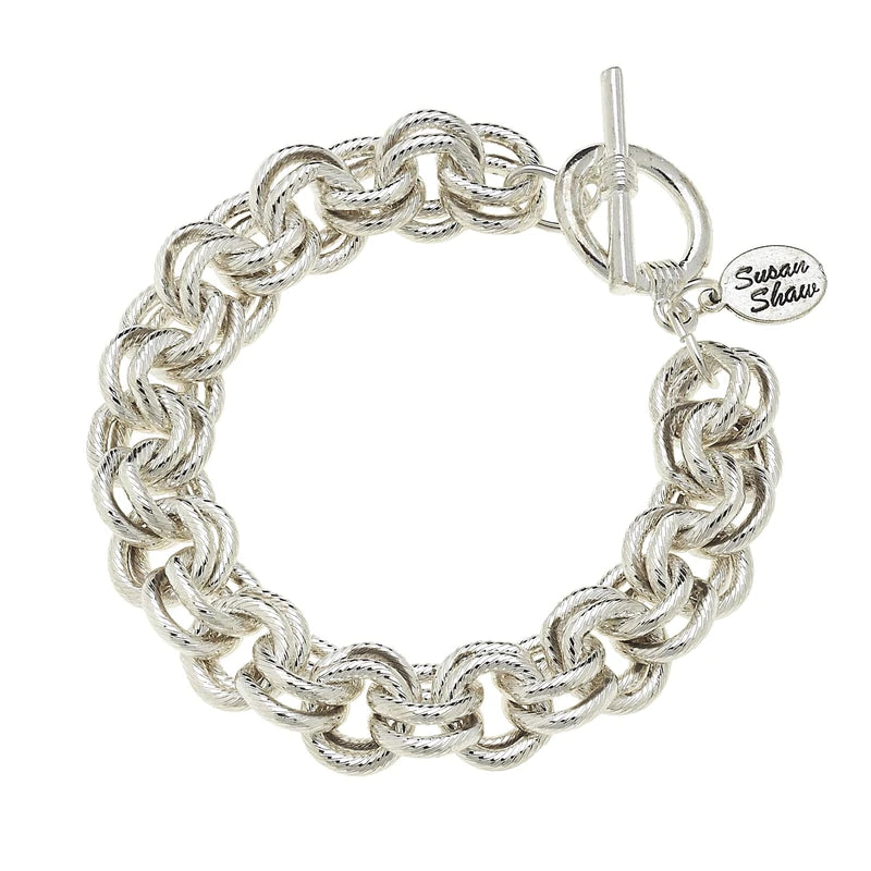 Full view of silver double chainlink bracelet with toggle closure