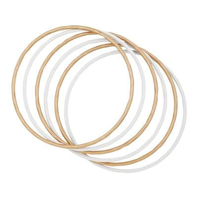 Gold and color coated bangles in white front view.