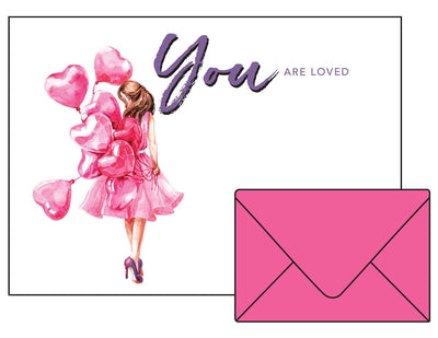 Girl in a pink dress and heels holding pink heart balloons "you are loved" cover note card and pink envelop