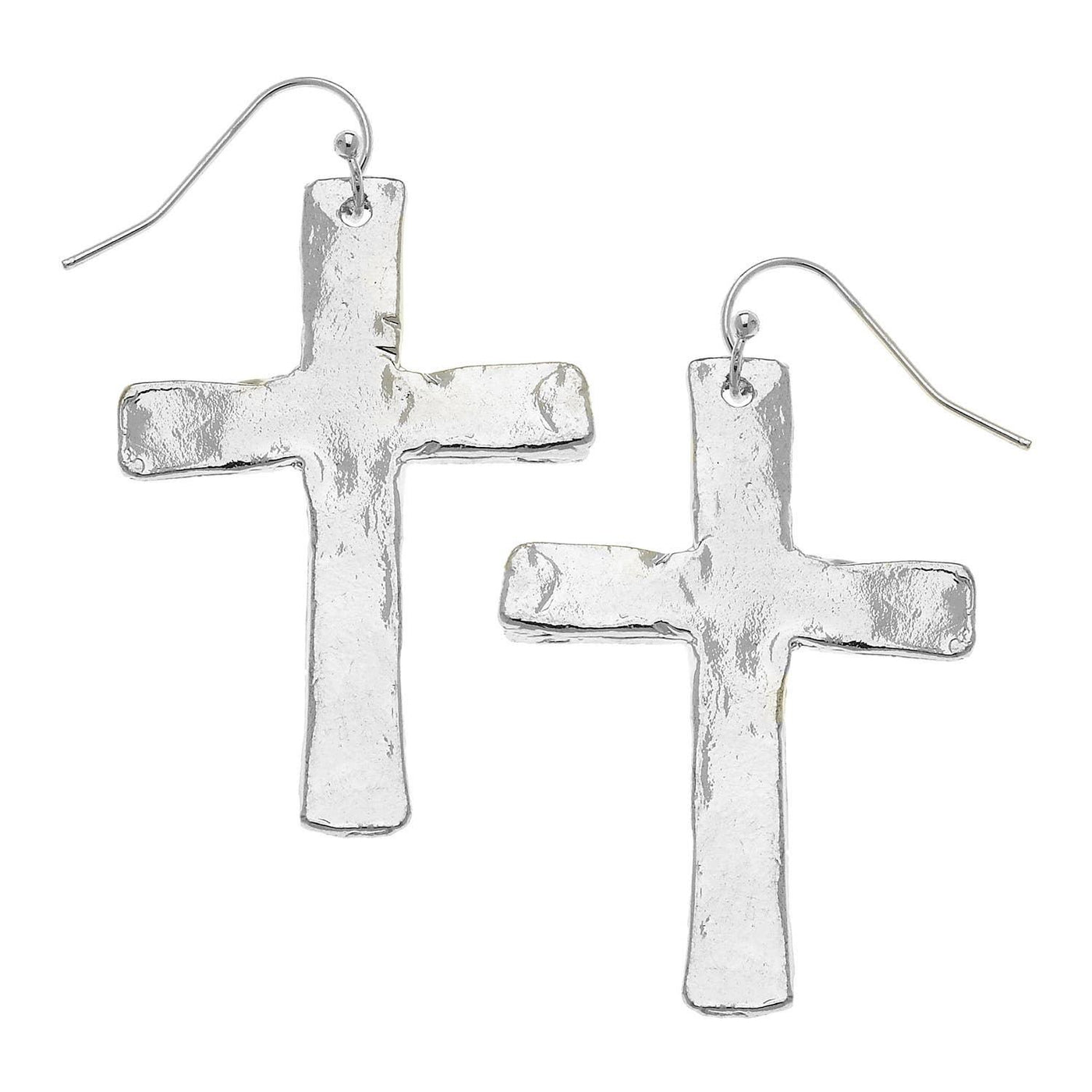 Worn silver cross earrings with a fishhook backing