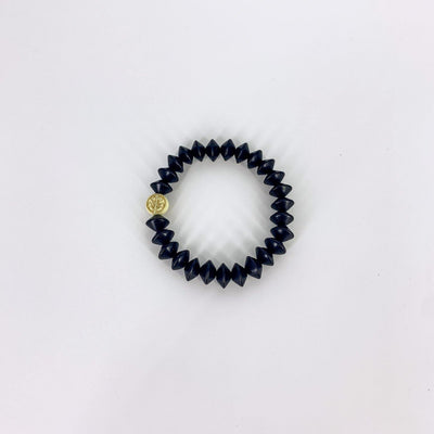 Black conical beaded bracelet with an Anchor beads trademark bead