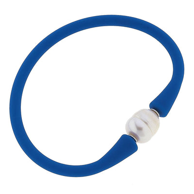 Blue silicone bracelet with a small pearl bead