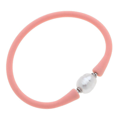 Blush silicone bracelet with a small pearl bead