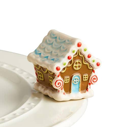 Tiny ginger bread house with all the decor for decorating a Nora Fleming dish