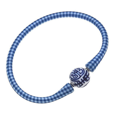 Blue checkered silicone bracelet with a small chinoiserie bead