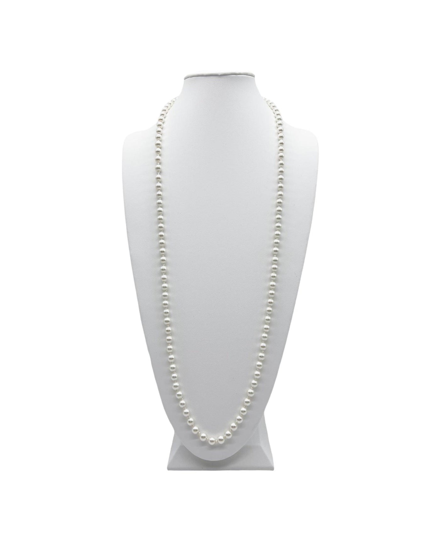 Long pearl necklace on a white neck display