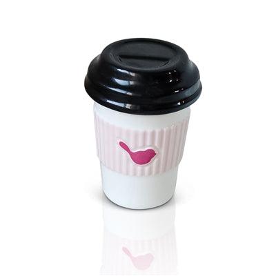To go cup of coffee with the iconic Nora Fleming pink bird