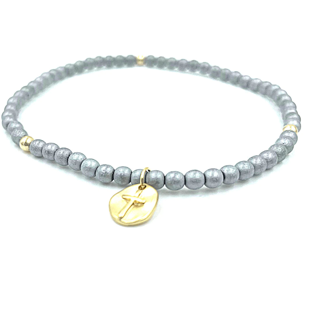 Blue-grey seed bead bracelet with a gold circle cross pendant