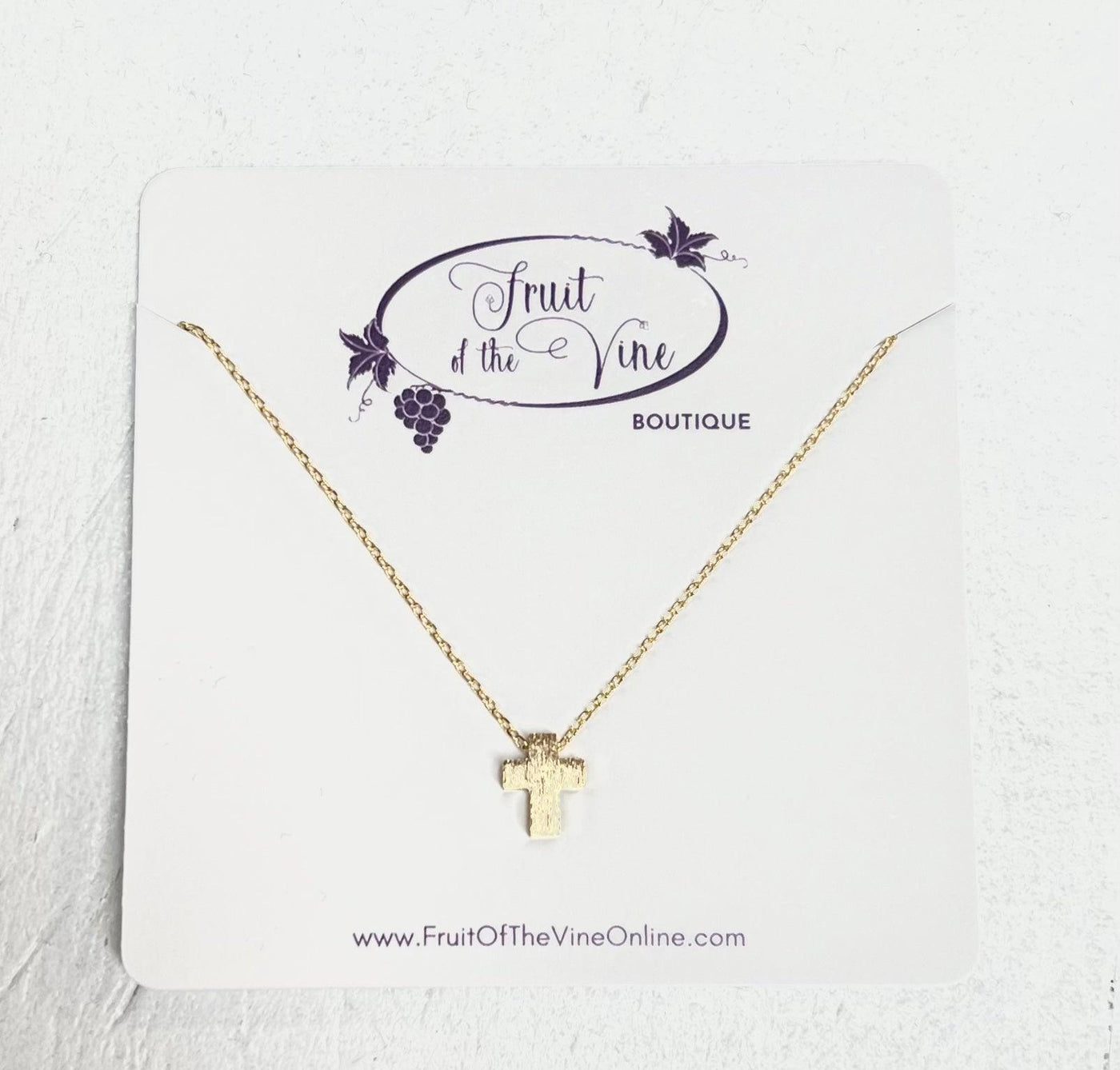 Simple gold cross on a lightweight chain